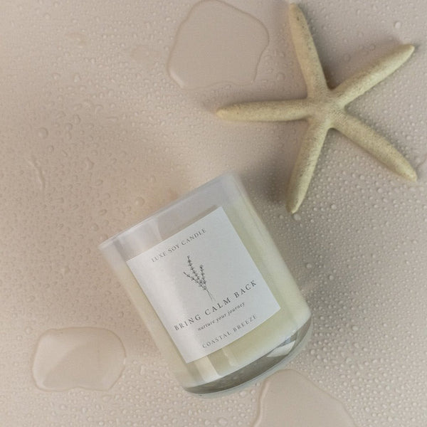 Coastal Breeze Candle with zesty scents of lime, lemon, wild freesia, and lavender, mixed with warm notes of amber and sandalwood, takes you on a seaside escape. Perfect for refreshing any room, presented in a reusable glass jar with sealable lid and drawstring bag, 270g of 100% Natural Soy Wax will burn for 40+ hours.