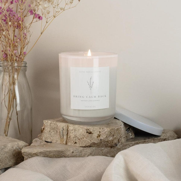 et empowered with the Invicta Candle's luxurious blend of blood orange, grapefruit, nutmeg, and clove, rounded off with leather and white wood notes. Perfect for creating a sophisticated and masculine atmosphere in your home or workspace. Presented in a Reusable Glass Jar with Sealable Lid and Drawstring Bag, the 270g of 100% Natural Soy Wax will burn for 40+ hours of strong scents and complement any decor.