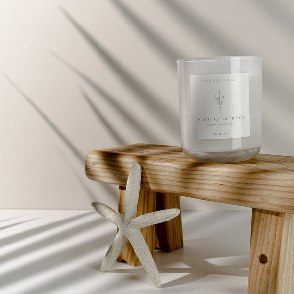 A tropical paradise captured in a candle, with notes of coconut, lime, and vanilla. Reminiscent of a luxurious resort, lounging by the pool with a fruity cocktail. Presented in a reusable glass jar with a sealable lid and drawstring bag, containing 270g of 100% natural soy wax that burns for over 40 hours